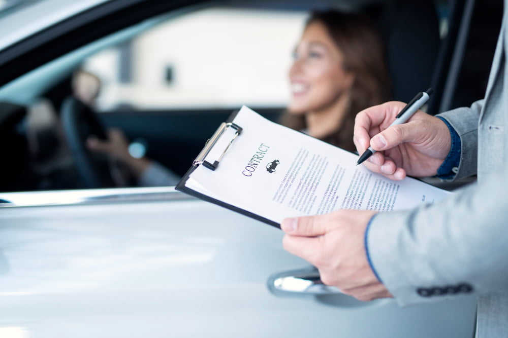 happy customer buying brand new car local car dealership