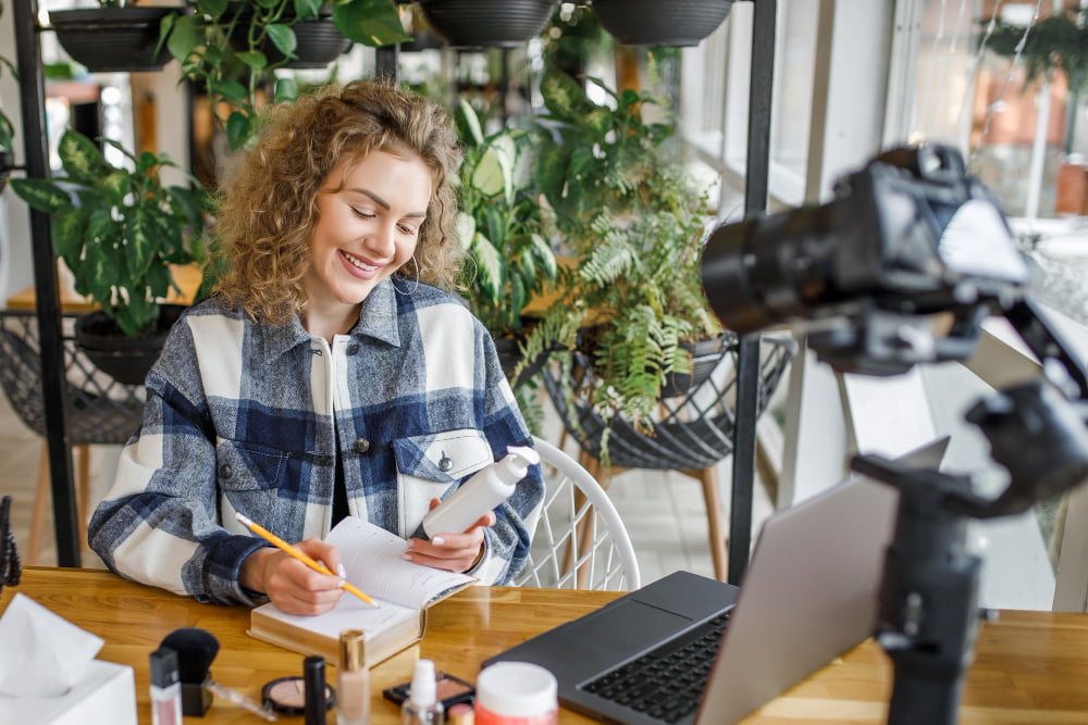 pretty blonde influencer testing new products camera