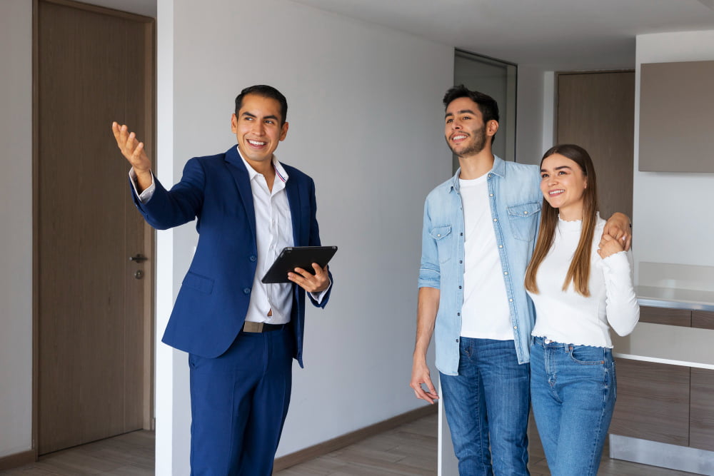 medium shot couple talking real estate agent